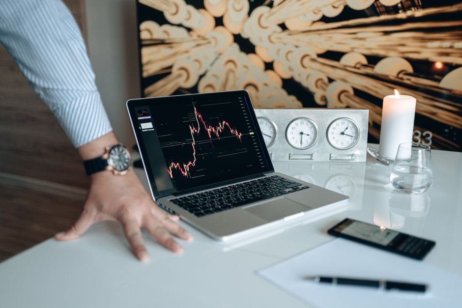 Calm investor reviewing DCA investing strategy Europe on laptop with coffee