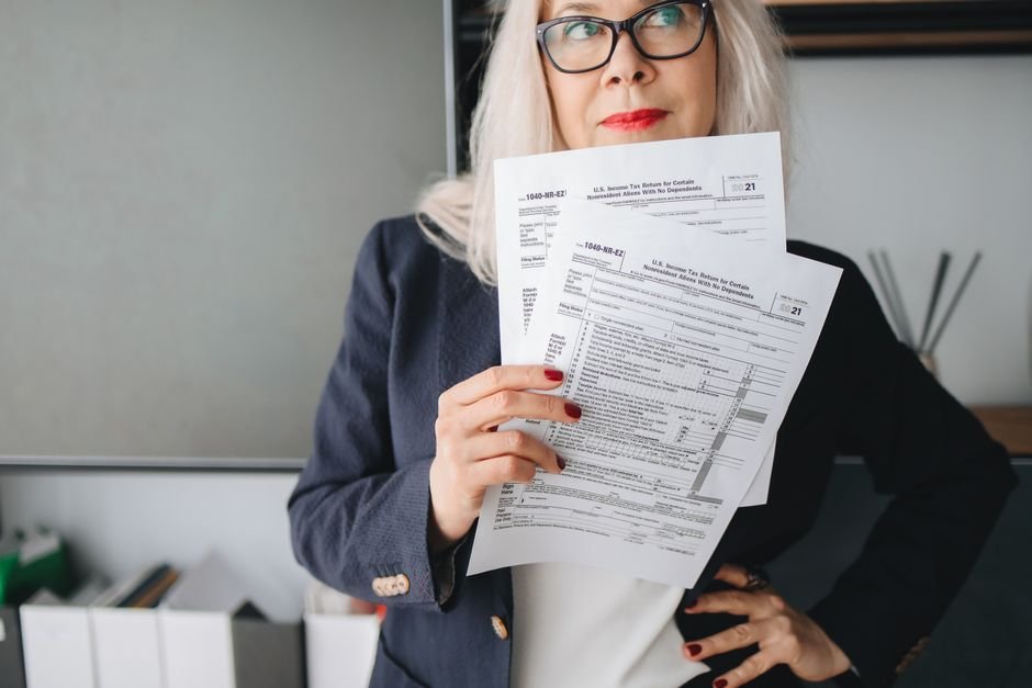 Investor reading tax document about ETF tax Belgium explained