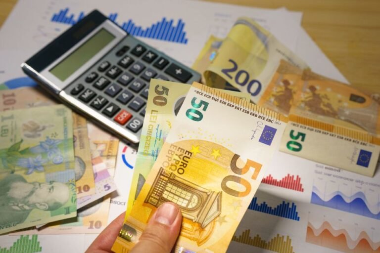 European tax documents and ETF charts on a desk showing overview of ETF taxation across Europe