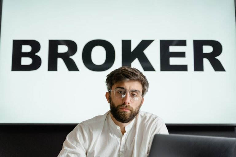 Worried French investor researching ETF tax regulations on laptop at home office