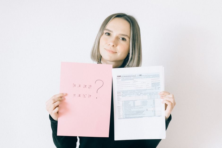 Confused person surrounded by tax papers and documents, representing the complexity of ETF tax declaration in Germany