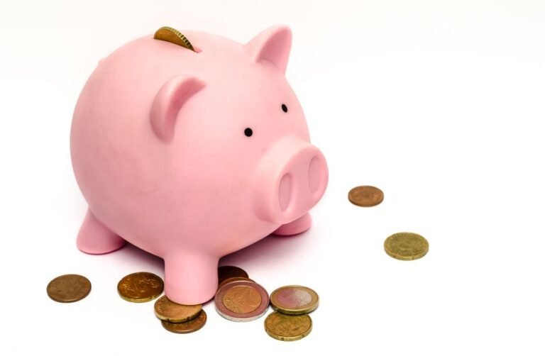 Growing money tree next to a European piggy bank comparing ETF investing versus savings accounts in Europe