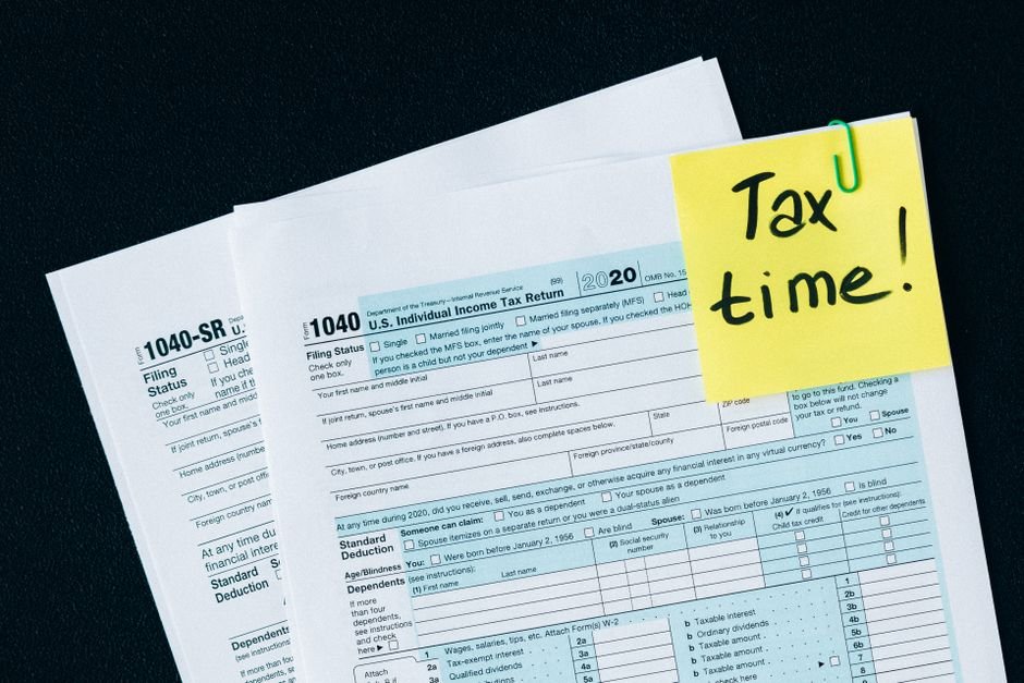 German tax form Freistellungsauftrag with pen and calculator on office desk