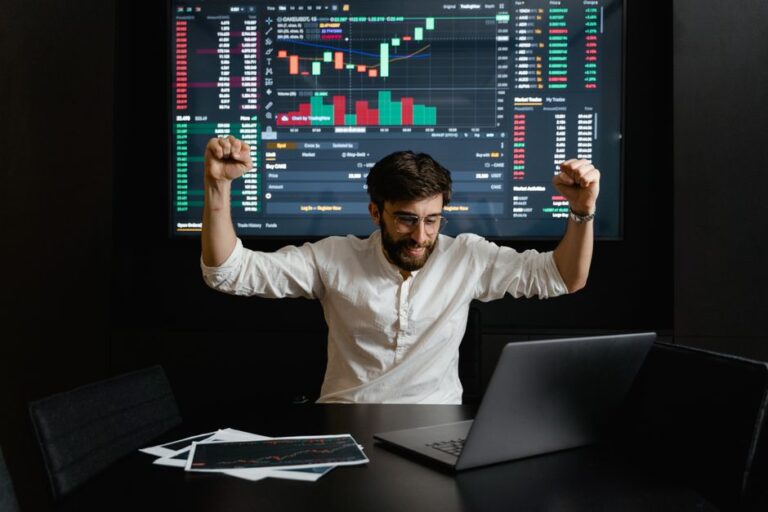 Young European investor using a laptop with coffee while comparing the best neobroker Europe 2026 options