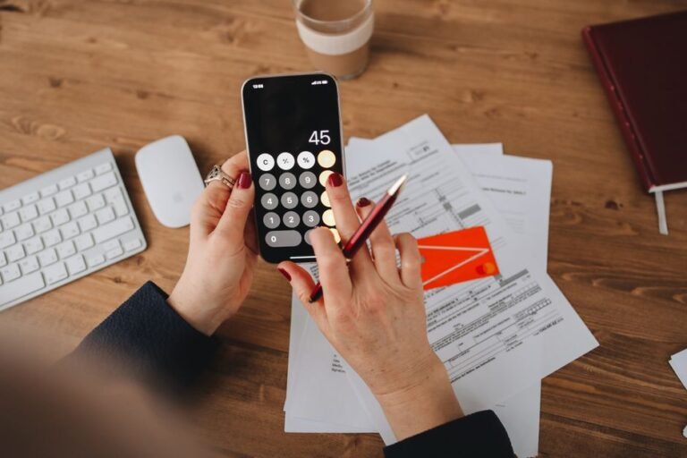 Person checking a personal finance app on their phone in Europe