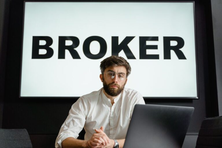 Person comparing best stock brokers in Europe on laptop screen