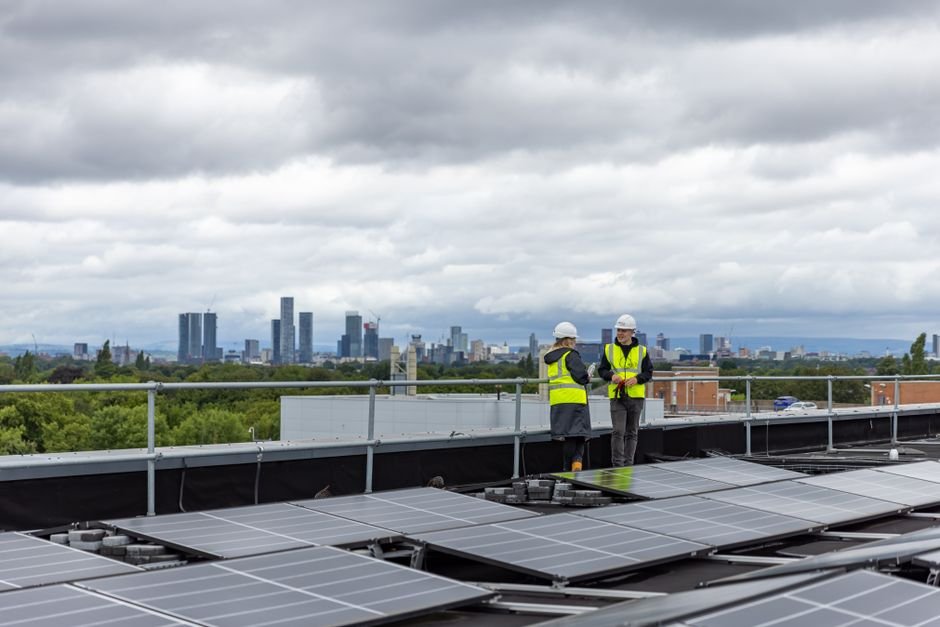 Solar panels on European buildings with city skyline background representing clean energy ETF Europe investments