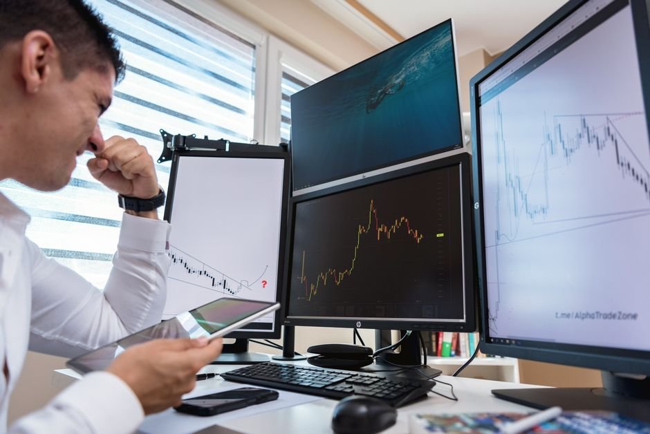 Confused investor at desk reviewing dividend withholding tax documents in Europe