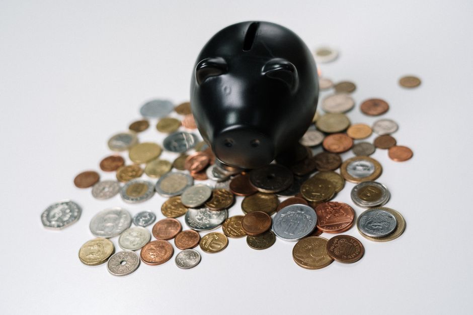 Person investing with spare change through a fractional shares Europe broker on mobile app