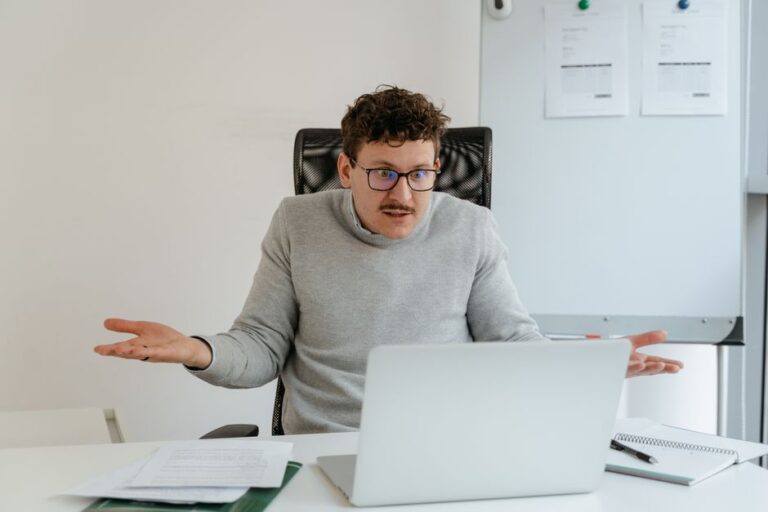 Confused investor at laptop wondering how ETFs work explained simply