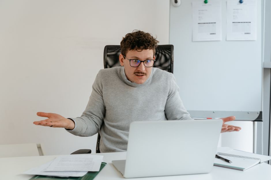Confused investor at laptop wondering how ETFs work explained simply