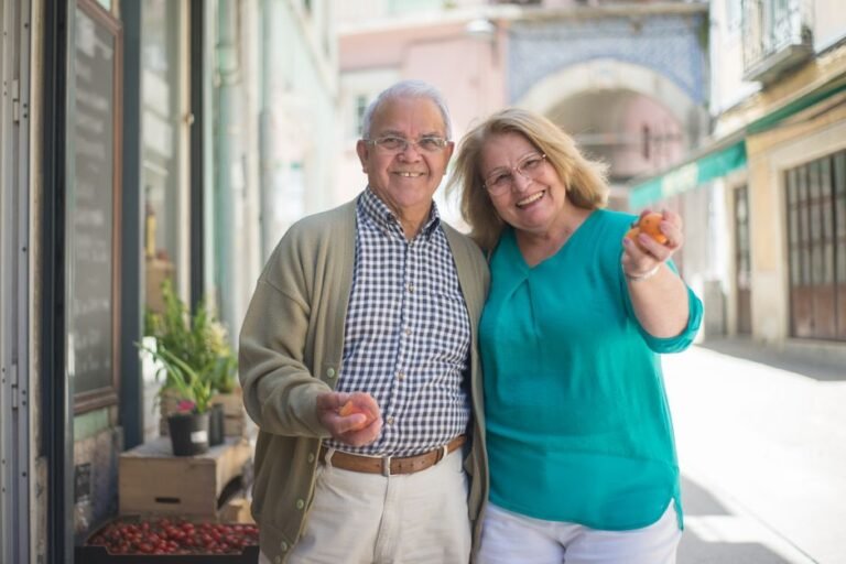 Couple reviewing retirement savings and financial planning documents for retirement in Europe