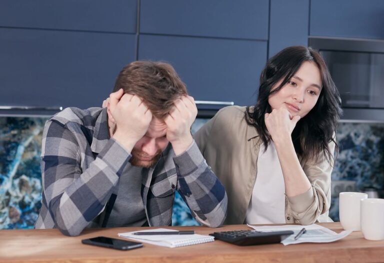 Worried European person using a calculator while planning retirement savings by age 40