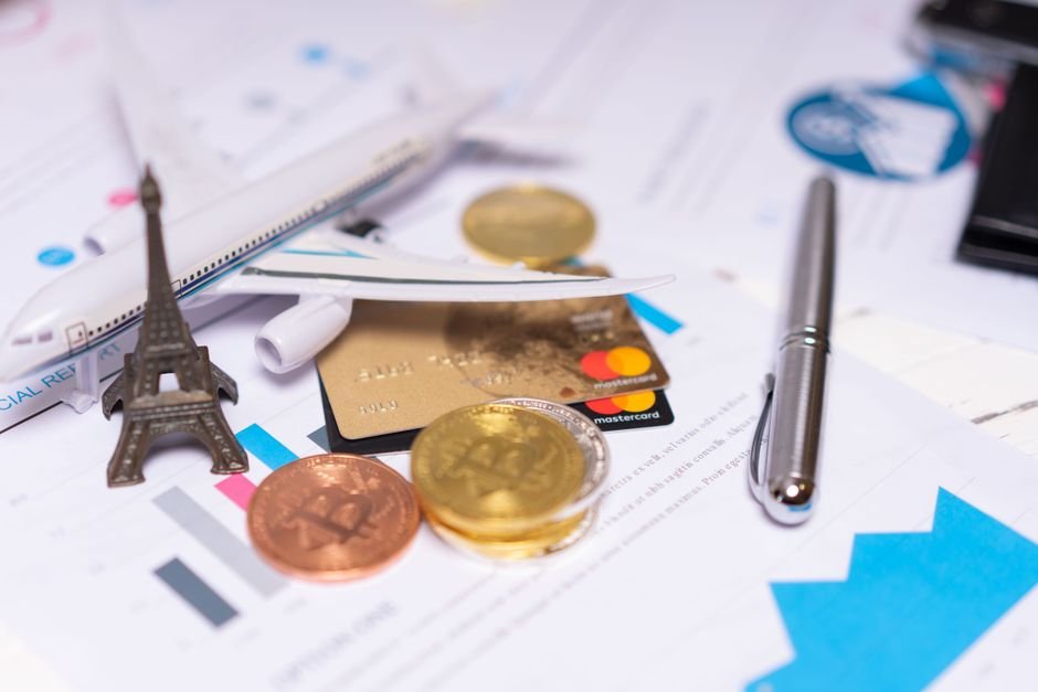 Beginner's guide to investing in France with euro coins and financial charts on a desk
