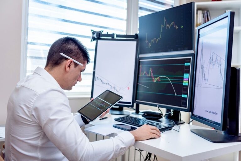 European stock market investor opening an investment account on a laptop