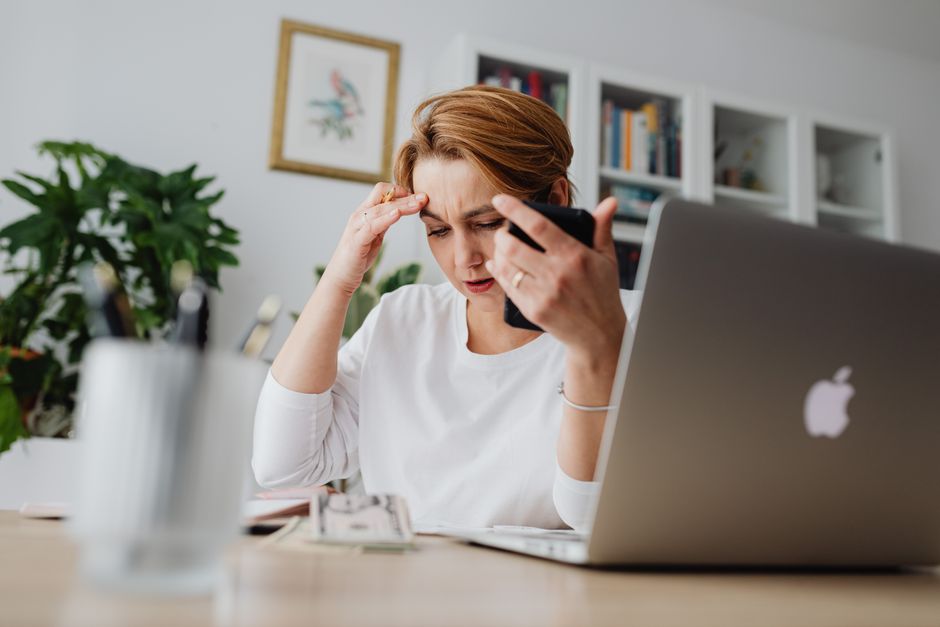 Worried investor checking phone about Trade Republic safety and security