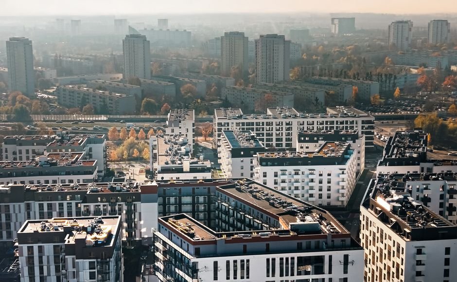 European city skyline with modern buildings representing real estate ETF and REIT property investment opportunities