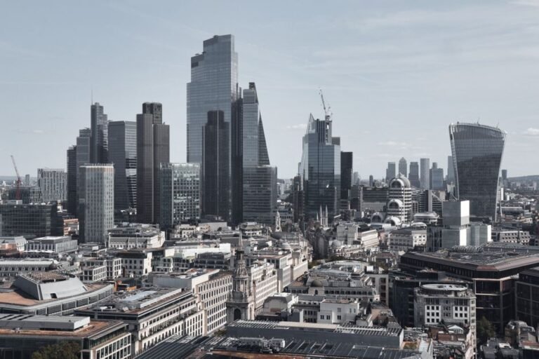 European city skyline with coins and currency symbols representing where to invest money in Europe 2026