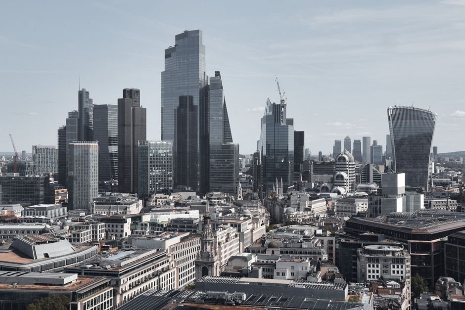 European city skyline with coins and currency symbols representing where to invest money in Europe 2026